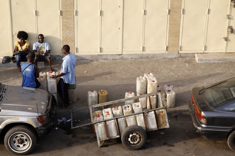 A vendor sells water in Monrovia, Liberia. Image by Sumaya Agha. Liberia, 2012. Media file: water-liberia_blog_main_horizontal.jpg