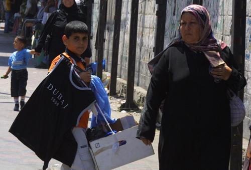 Until about a year ago, consumer goods were in short supply. An easing of the Israeli blockade and proliferation of smuggling tunnels from Egypt has made clothing and some other goods more available. Image by Reese Erlich. Gaza, 2011.
